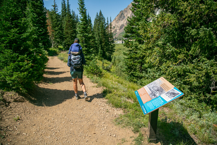 mom and son hiking along lower albion meadows near the interpretive signs