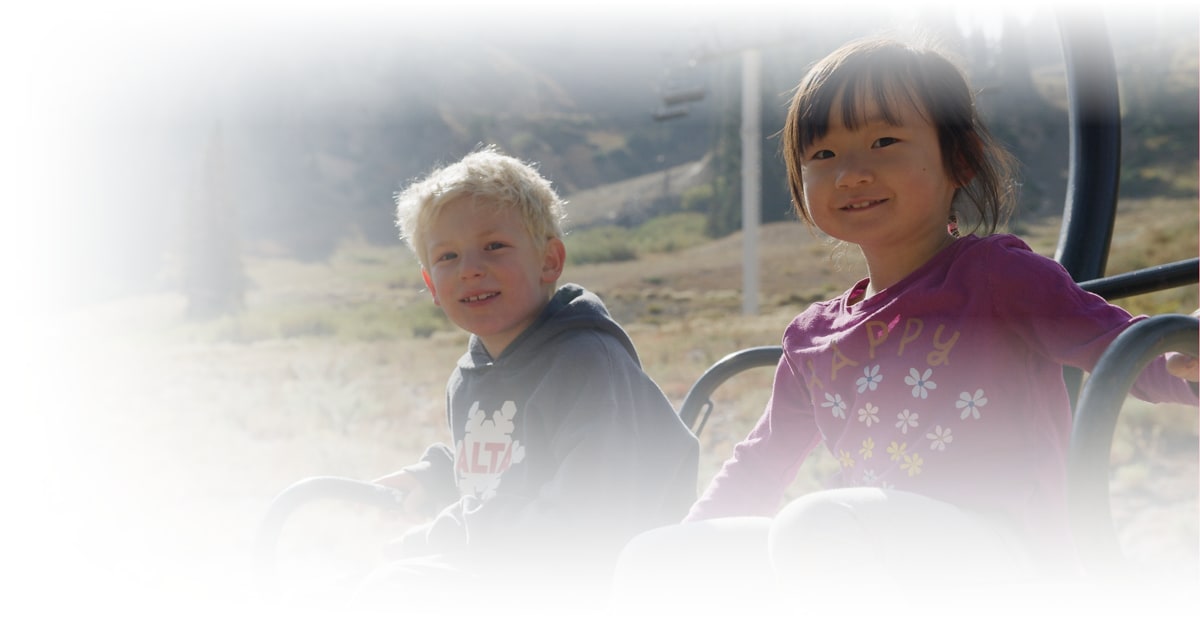 The Alta Environmental Center logo on the mountains of Alta Ski Area