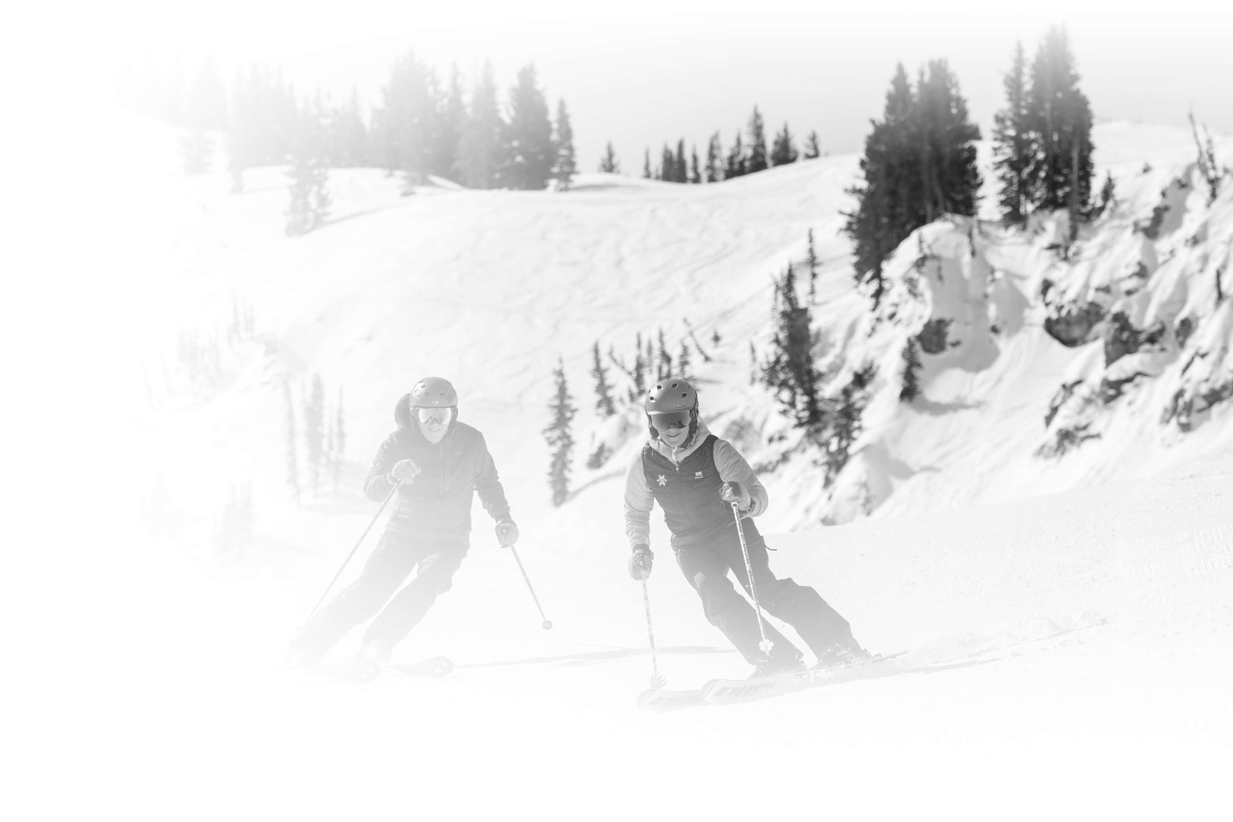 Two Alta skiers enjoy some great groomers from Collins lift at Alta Ski Area