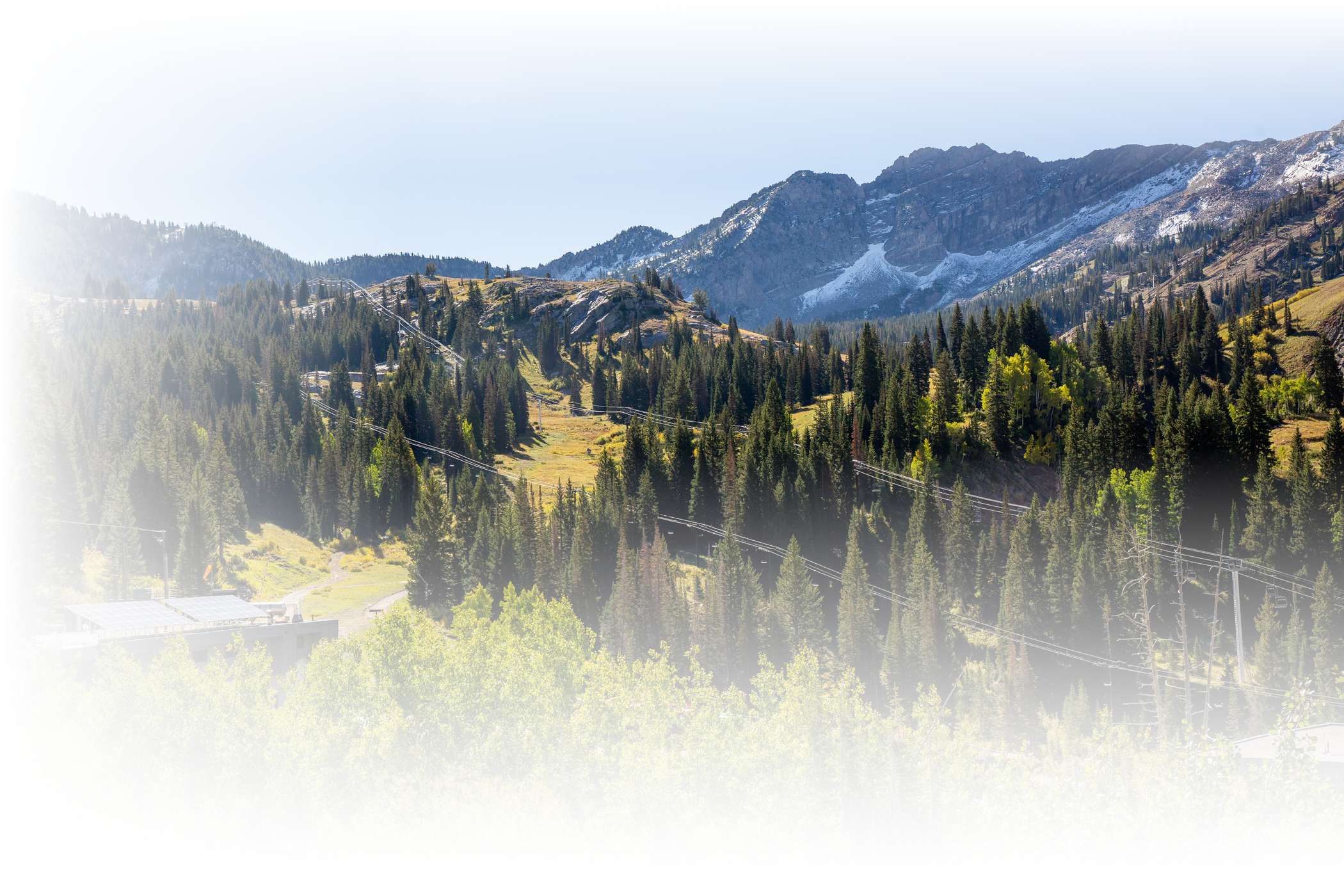 Solar panels on the roof of an Alta Ski Area building on a sunny summer day